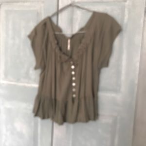 T-shirt like from Free People. Light khaki colour Size medium. Shoulder drop